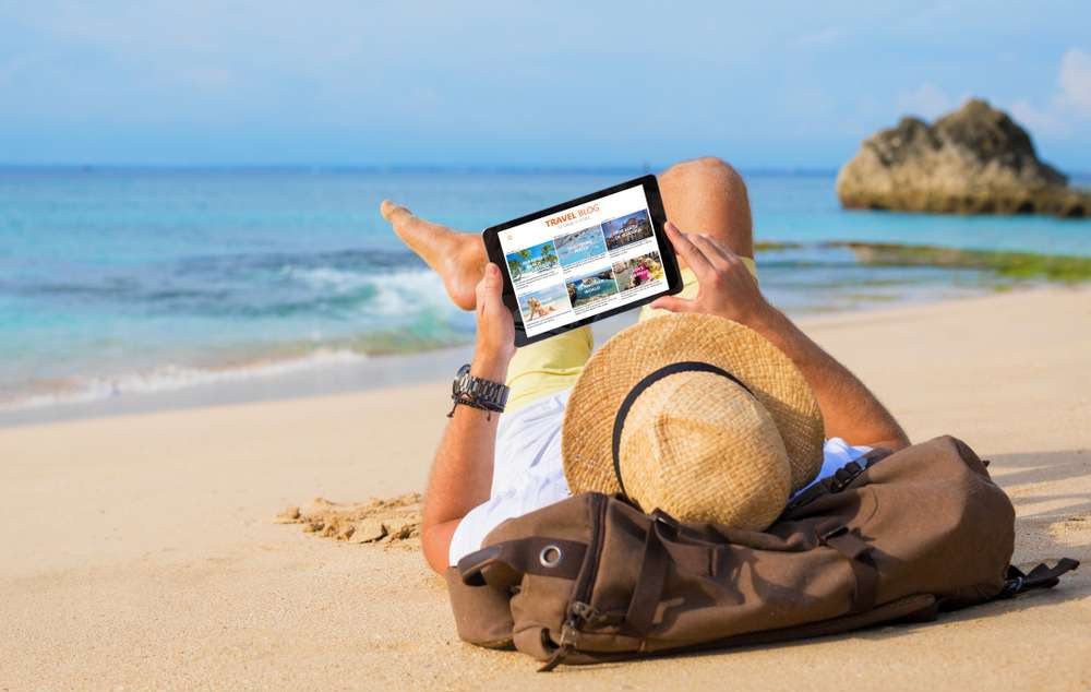 Traveller planning a journey with travel documents
